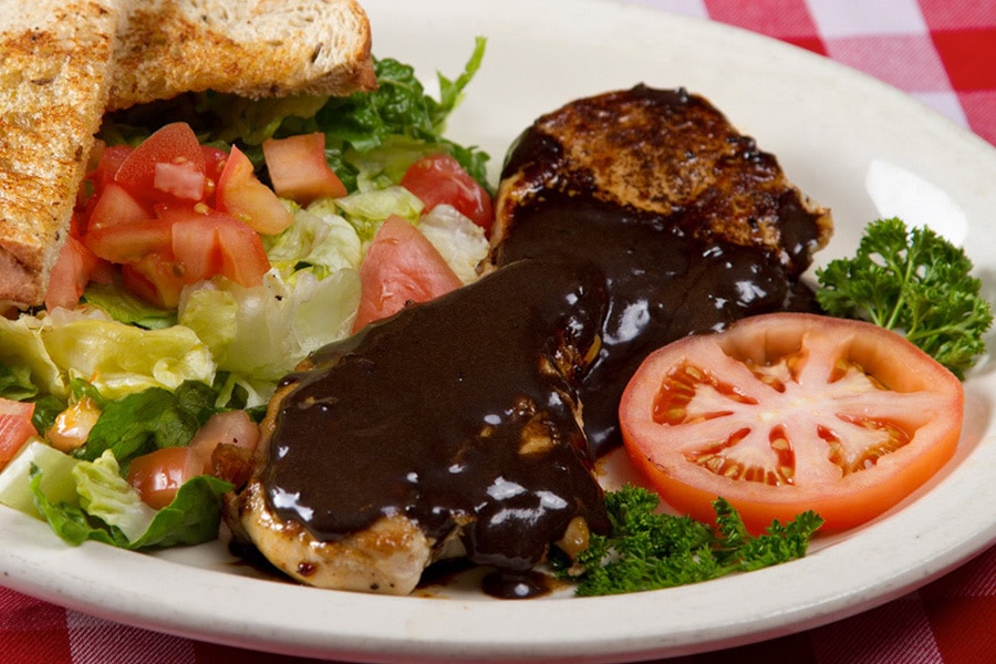 Herman’s garlic chicken with salad and garlic bread